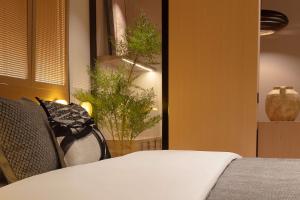 Postel nebo postele na pokoji v ubytování 成都s恩季酒店春熙路太古里店