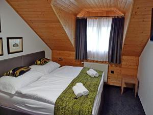 Postel nebo postele na pokoji v ubytování Hotel a vinařství Sádek