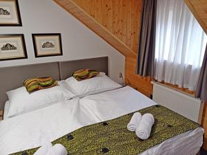 Postel nebo postele na pokoji v ubytování Hotel a vinařství Sádek