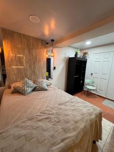 Postel nebo postele na pokoji v ubytování Oasis Urbano San Benito