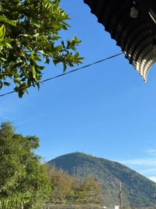 a mountain in the distance with a blue sky at Lullaby Homestay in Ấp Thanh Sơn (1)