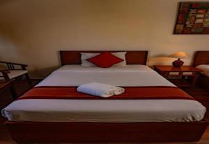 Postel nebo postele na pokoji v ubytování Puri Dibia Hotel by Secoms