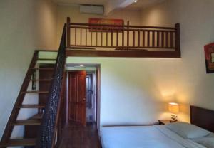 Postel nebo postele na pokoji v ubytování Puri Dibia Hotel by Secoms