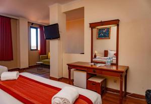 Postel nebo postele na pokoji v ubytování Puri Dibia Hotel by Secoms