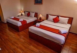 Postel nebo postele na pokoji v ubytování Puri Dibia Hotel by Secoms