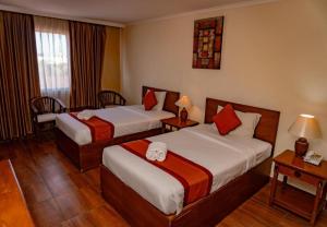 Postel nebo postele na pokoji v ubytování Puri Dibia Hotel by Secoms