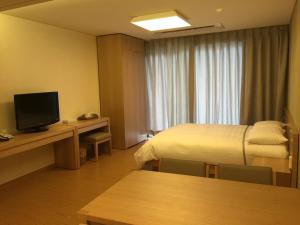 TV a/nebo společenská místnost v ubytování Kumho Jeju Resort