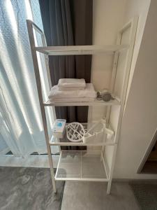 a white shelving unit in a room with a window at SABBATH uzumaza 103 in Kyoto +34 photos