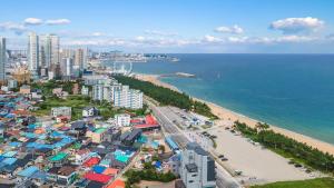 an aerial view of a city and a beach at Sokcho World Pet-Friendly (Paid) Pension in Sokcho