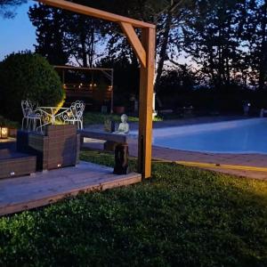 a picnic table in a yard at night at Gite le nid du canal in La Celle-sous-Gouzon