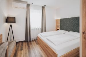 Voodi või voodid majutusasutuse Feichter Hotel & Bistro toas