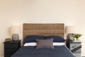 Ένα ή περισσότερα κρεβάτια σε δωμάτιο στο Mingara Park Cottage