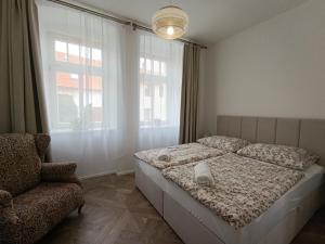 Postel nebo postele na pokoji v ubytování Rezidence Valcha