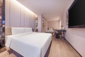 Voodi või voodid majutusasutuse Atour Hotel Tianjin Jinwan Square Fifth Avenue toas