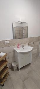 a bathroom with a sink and a mirror at La Fattoria dei Desideri in Ripa Teatina