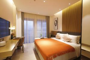 Cama o camas de una habitación en Citadines Songshan Lake Dongguan