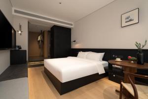 Postelja oz. postelje v sobi nastanitve Chongqing Jiefangbei Jiayu Hotel