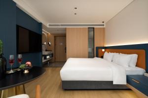 Postelja oz. postelje v sobi nastanitve Chongqing Jiefangbei Jiayu Hotel