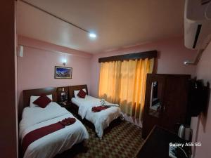Ένα ή περισσότερα κρεβάτια σε δωμάτιο στο The hotel mountain Taplejung