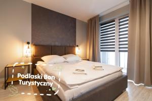 Posteľ alebo postele v izbe v ubytovaní Apartamenty Białystok - Botaniczna 9A/21