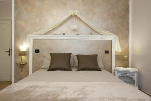 A bed or beds in a room at Torretta d'Assisi