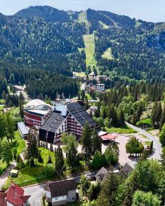 an aerial view of a resort in the mountains at Hotel Piatra Mare in Poiana Brasov