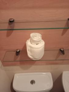 a glass shelf above a toilet in a bathroom at Seaside chalet in Ardmore with breathtaking views in Ardmore +37 photos