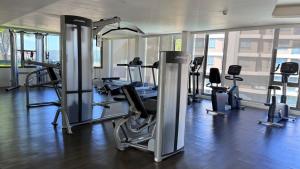 a gym with several tread machines in a room at Veranda by Welcome Hua Hin in Hua Hin +1 photo