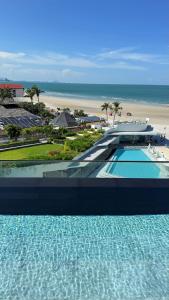 a view of a resort with a swimming pool and a beach at Veranda by Welcome Hua Hin in Hua Hin