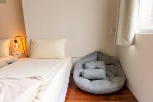 Postelja oz. postelje v sobi nastanitve Maybe Homestay