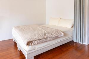 Postelja oz. postelje v sobi nastanitve Maybe Homestay