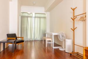 Predel za sedenje v nastanitvi Maybe Homestay