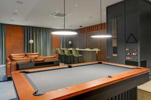 a living room with a pool table in it at Comfort Apartments Botanika in Gdańsk