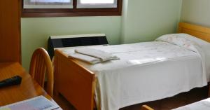 Posteľ alebo postele v izbe v ubytovaní Albergo Escondido