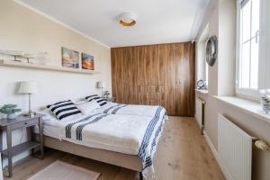 Posteľ alebo postele v izbe v ubytovaní Słoneczny Apartament Sopot