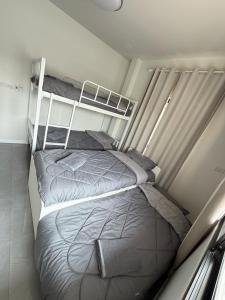 a bedroom with two bunk beds in it at The Wing Pool Villa Surin in Surin +19 photos