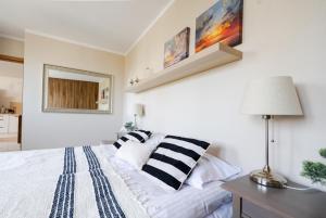 Posteľ alebo postele v izbe v ubytovaní Słoneczny Apartament Sopot