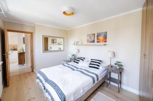Posteľ alebo postele v izbe v ubytovaní Słoneczny Apartament Sopot