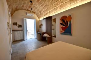 Postel nebo postele na pokoji v ubytování Monachile Suite & Room - Housea