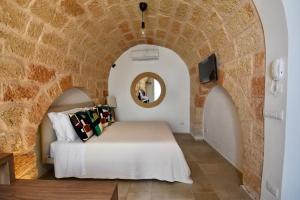 Postel nebo postele na pokoji v ubytování Monachile Suite & Room - Housea
