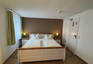 Postel nebo postele na pokoji v ubytování Hotel Stadt Soest