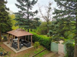 a gazebo with a tent in a garden at Villa Evetes in Jablonov nad Turnou