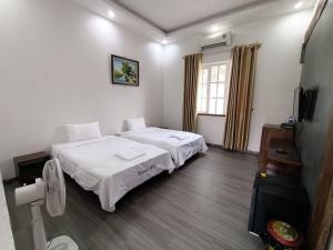 Postel nebo postele na pokoji v ubytování Resort HTC Tuần Châu