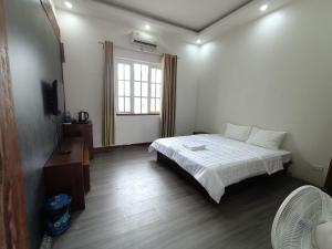 TV a/nebo společenská místnost v ubytování Resort HTC Tuần Châu + 9 fotografií