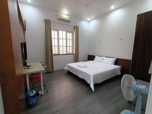 Postel nebo postele na pokoji v ubytování Resort HTC Tuần Châu