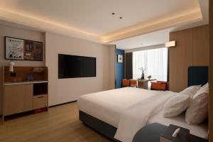 TV in/ali zabaviščno središče v nastanitvi Chongqing Jiefangbei Jiayu Hotel