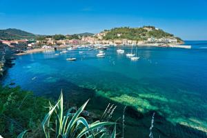 a group of boats in a body of water at Casa Romita 9 - ArgonautiVacanze in Porto Azzurro