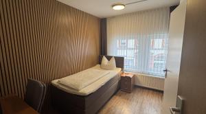 Postel nebo postele na pokoji v ubytování Hotel Stadt Soest