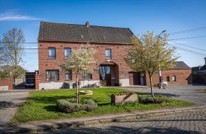 a brick house with two trees in front of it at Chambres d'Eole - B&B -TOURNAI in Tournai