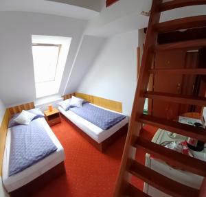 Postel nebo postele na pokoji v ubytování Wellness & Sport Hotel TTC